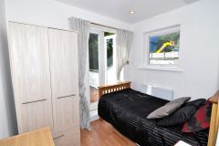 A contemporary single room with private terrace